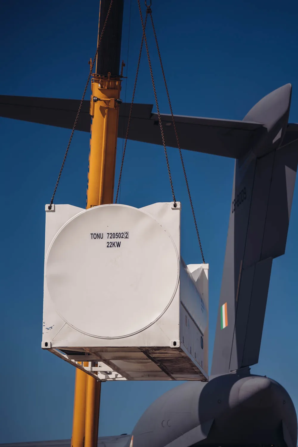 Bofort 20 ft oxygen ISO tank lifted by crane beside the tail of an Indian Air Force C-17 at Ostend Airport
